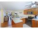 Kitchen with island and view into living area at 6033 34Th W St # 120, Bradenton, FL 34210