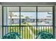 Screened patio with view of community pool and grounds at 6033 34Th W St # 120, Bradenton, FL 34210