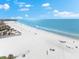 Aerial view of a beautiful beach with clear water and white sand at 6312 Midnight Pass Rd # 702S, Sarasota, FL 34242