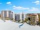 Aerial view of a building, beach and ocean at 6312 Midnight Pass Rd # 702S, Sarasota, FL 34242