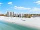 Aerial view of beachfront buildings and beach at 6312 Midnight Pass Rd # 702S, Sarasota, FL 34242