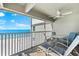 Relaxing balcony with ocean views and outdoor seating at 6312 Midnight Pass Rd # 702S, Sarasota, FL 34242