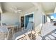 Spacious balcony with ocean view and patio furniture at 6312 Midnight Pass Rd # 702S, Sarasota, FL 34242