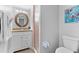 Clean bathroom with granite vanity and a shower at 6312 Midnight Pass Rd # 702S, Sarasota, FL 34242