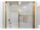 Clean bathroom with a shower/tub and gold-toned accents at 6312 Midnight Pass Rd # 702S, Sarasota, FL 34242