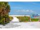 Pathway to Siesta Beach; wooden walkway over vegetation at 6312 Midnight Pass Rd # 702S, Sarasota, FL 34242