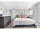 Spacious bedroom with king-size bed and dresser at 6312 Midnight Pass Rd # 702S, Sarasota, FL 34242