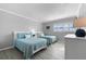 Guest bedroom with two twin beds and white dresser at 6312 Midnight Pass Rd # 702S, Sarasota, FL 34242