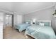 Guest bedroom with two twin beds and en-suite bathroom at 6312 Midnight Pass Rd # 702S, Sarasota, FL 34242