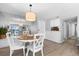Open dining area with white table and chairs at 6312 Midnight Pass Rd # 702S, Sarasota, FL 34242