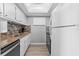 Well-equipped kitchen with granite countertops and modern appliances at 6312 Midnight Pass Rd # 702S, Sarasota, FL 34242