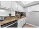 Updated kitchen with granite countertops, stainless steel appliances, and tile backsplash at 6312 Midnight Pass Rd # 702S, Sarasota, FL 34242