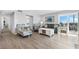 Living room with comfy seating and view of bedroom at 6312 Midnight Pass Rd # 702S, Sarasota, FL 34242