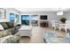 Open living space with ocean view, dining area, and hardwood floors at 6312 Midnight Pass Rd # 702S, Sarasota, FL 34242
