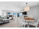 Bright living room with ocean view, comfy seating, and dining area at 6312 Midnight Pass Rd # 702S, Sarasota, FL 34242