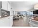 Bright living room with ocean view, comfy seating, and dining area at 6312 Midnight Pass Rd # 702S, Sarasota, FL 34242