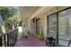 Private balcony with potted plants and seating at 6450 Wild Oak Bay Blvd # 238, Bradenton, FL 34210