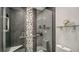 Spa-like bathroom with pebble stone accents and glass shower at 6450 Wild Oak Bay Blvd # 238, Bradenton, FL 34210