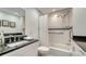 Clean bathroom with a bathtub, shower, and granite countertop at 6450 Wild Oak Bay Blvd # 238, Bradenton, FL 34210