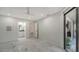 Bedroom with marble floors and access to bathroom and balcony at 6450 Wild Oak Bay Blvd # 238, Bradenton, FL 34210