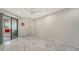 Bright bedroom with marble flooring and access to balcony at 6450 Wild Oak Bay Blvd # 238, Bradenton, FL 34210