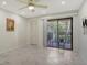 Bright bedroom with sliding glass doors leading to a balcony at 6450 Wild Oak Bay Blvd # 238, Bradenton, FL 34210