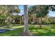 Two-story condo building with lush landscaping and paved walkways at 6450 Wild Oak Bay Blvd # 238, Bradenton, FL 34210