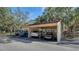 Covered carport parking for residents in a lush setting at 6450 Wild Oak Bay Blvd # 238, Bradenton, FL 34210