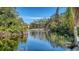 Serene pond with fountain, lush landscaping, and community views at 6450 Wild Oak Bay Blvd # 238, Bradenton, FL 34210