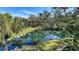 Scenic view of a pond and lush landscaping from a condo at 6450 Wild Oak Bay Blvd # 238, Bradenton, FL 34210
