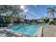 Relaxing community pool with surrounding lounge chairs at 6450 Wild Oak Bay Blvd # 238, Bradenton, FL 34210