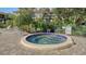 Inviting community spa with surrounding lounge chairs at 6450 Wild Oak Bay Blvd # 238, Bradenton, FL 34210