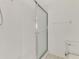 This bathroom includes tile surround, glass shower door, and modern toilet at 6750 Fairway Gardens Dr # 6750, Bradenton, FL 34203