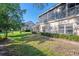 The home's exterior has a well-manicured lawn with mature trees and shrubs at 6750 Fairway Gardens Dr # 6750, Bradenton, FL 34203