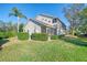 The exterior showcases a well-maintained property with green lawn and screened patio at 6750 Fairway Gardens Dr # 6750, Bradenton, FL 34203