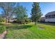 The home's lawn and landscaping provide curb appeal at 6750 Fairway Gardens Dr # 6750, Bradenton, FL 34203