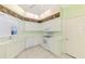 Bright kitchen with white appliances and a large window, offering a functional and inviting space at 6750 Fairway Gardens Dr # 6750, Bradenton, FL 34203