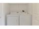 A laundry closet with a white washer and dryer at 6750 Fairway Gardens Dr # 6750, Bradenton, FL 34203