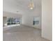 Bright living space with high ceilings, fan, neutral tones, carpet and tile floors at 6750 Fairway Gardens Dr # 6750, Bradenton, FL 34203
