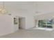 Spacious living area with tile and carpet, high ceilings, fan and lots of natural light at 6750 Fairway Gardens Dr # 6750, Bradenton, FL 34203