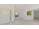 Open living area with tile flooring, high ceilings, and bright windows, creating a welcoming atmosphere at 6750 Fairway Gardens Dr # 6750, Bradenton, FL 34203