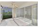 The screened patio features large sliding glass doors leading into the home at 6750 Fairway Gardens Dr # 6750, Bradenton, FL 34203