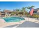The community pool and an American flag create an inviting outdoor space for relaxation at 6750 Fairway Gardens Dr # 6750, Bradenton, FL 34203