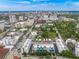 Aerial view showcasing townhome community near city skyline at 72 N School Ave, Sarasota, FL 34237