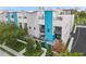 Modern townhouse with rooftop patio, city views in background at 72 N School Ave, Sarasota, FL 34237