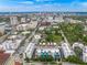 Aerial view of modern townhouses with city skyline in background at 72 N School Ave, Sarasota, FL 34237
