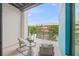 Private balcony with seating area, offering views of the surrounding area at 72 N School Ave, Sarasota, FL 34237