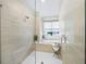 Spa-like bathroom with soaking tub and glass shower at 72 N School Ave, Sarasota, FL 34237
