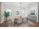 Elegant dining room with hardwood floors and modern chandelier at 72 N School Ave, Sarasota, FL 34237