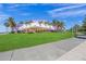 Purple building with white accents and palm trees at 72 N School Ave, Sarasota, FL 34237